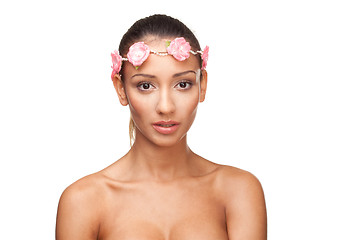 Image showing Beautiful young woman with a floral arrangement