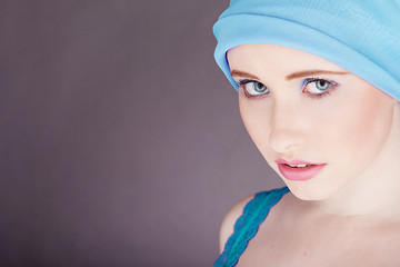 Image showing woman with blue fabric wrapped around head