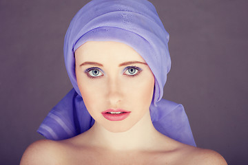 Image showing woman with blue fabric wrapped around head