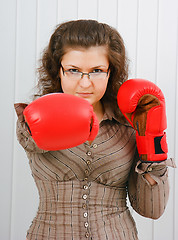 Image showing Business woman with boxing gloves
