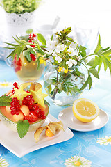 Image showing Summer refreshment with dessert fruit and lemonade