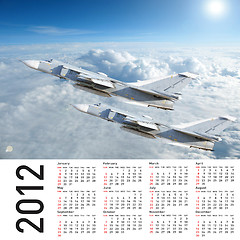 Image showing 2012 Calendar with a military plane in the sky and clouds