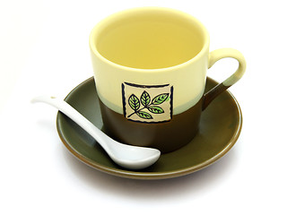 Image showing Ceramic cup on a saucer with drawing 