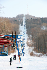 Image showing Skiers go on the lift on mountain