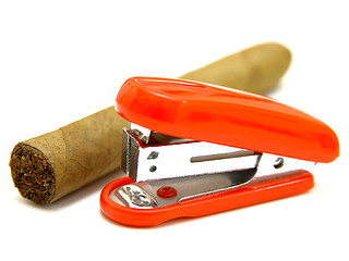 Image showing Red stapler and cigar 