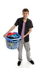 Image showing Teenager with laundry