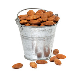 Image showing Tin bucket full of almonds