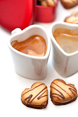 Image showing heart shaped cream cookies on red heart metal box and coffee