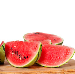 Image showing fresh watermelon on a  wood table
