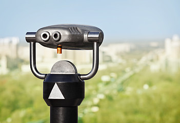 Image showing Binoculars to observe green city