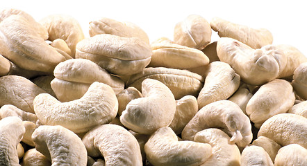 Image showing Pile of roasted cashew nuts in isolated white background