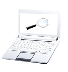 Image showing Laptop with blank white screen and magnifying glass.