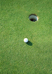 Image showing golf ball hole on a field