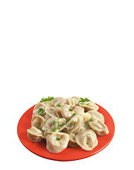 Image showing Russian national ravioli with dill on a plate