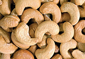 Image showing Unshelled roasted cashew nuts isolated on white, food background