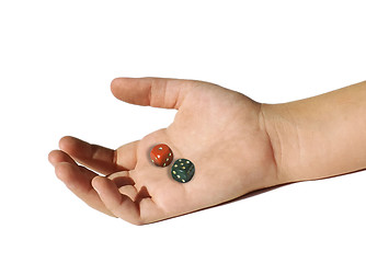 Image showing dice in a desaturated hand