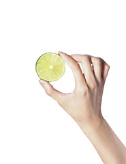 Image showing fresh ripe lime in hand on white background
