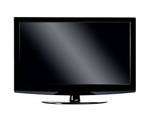 Image showing Black LCD tv screen hanging on a wall with shadow