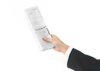 Image showing newspaper in hand isolated on white
