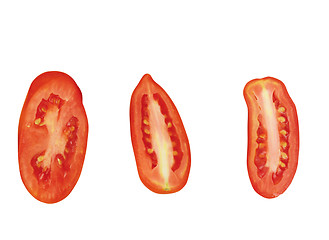 Image showing close up of slices of ripen tomato piled on white background