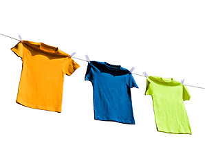 Image showing Photograph of four blank t-shirts