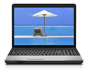 Image showing Computer notebook on beach - business travel background