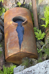 Image showing broken barrels with oil