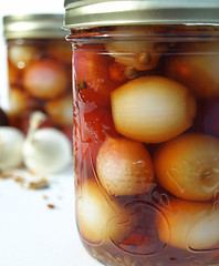 Image showing Two jars with onions up close