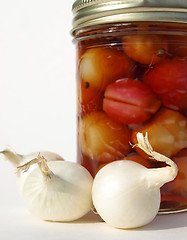 Image showing White onions with jar