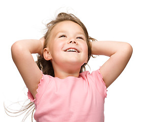 Image showing Little girl is stretching and rising hands up