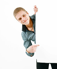 Image showing A young man of a white bench