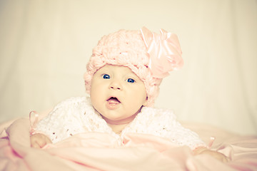 Image showing baby girl in a pink hat