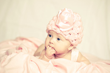 Image showing baby girl in a pink hat