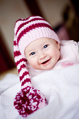 Image showing smiling baby girl in hat with pompom