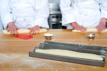 Image showing Rolling the dough with hands