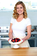 Image showing Attractive female presenting yummy treat