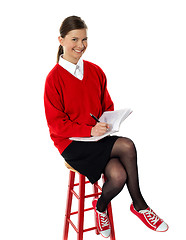 Image showing Confident girl doing her homework