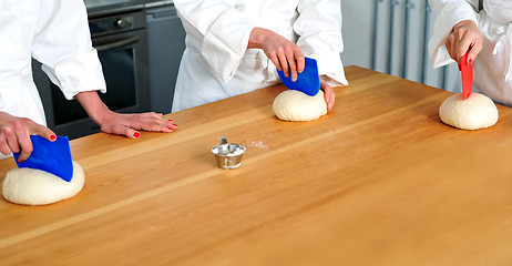 Image showing Women hands kneading dough