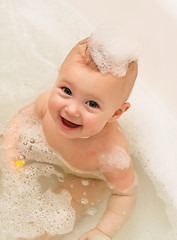 Image showing Adorable bath baby with soap suds