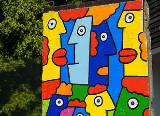 Image showing Piece of Berlin Wall with colorful graffiti