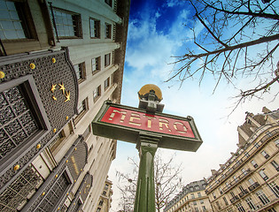 Image showing Metro Sign in Paris with Architecture in background