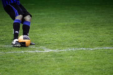 Image showing Kicking the Ball during a Football Match