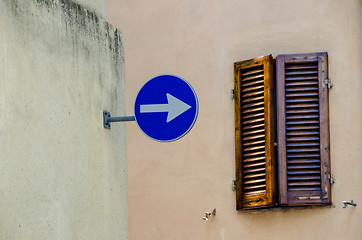 Image showing One way sign with old window