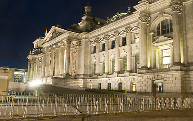 Image showing  Reichstag Parliament building main entrance flags blowing night