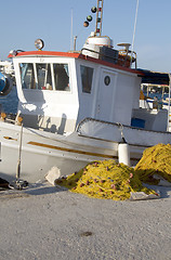 Image showing traditional Greek island fishing boat with nets Milos Greece