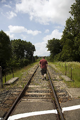 Image showing Man following tracks