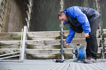 Image showing Engineer running tests