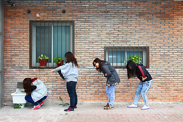 Image showing Asian woman queuing for toilet