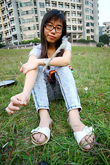 Image showing Chinese girl playing grasses