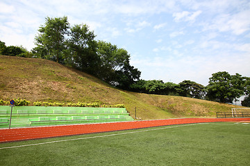 Image showing Stadium chairs and running track